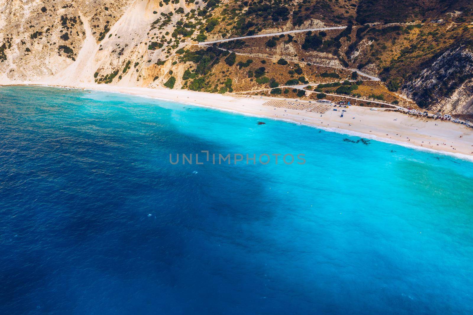 Aerial drone view of iconic turquoise and sapphire bay and beach of Myrtos, Kefalonia (Cephalonia) island, Ionian, Greece. Myrtos beach, Kefalonia island, Greece. Beautiful view of Myrtos beach.