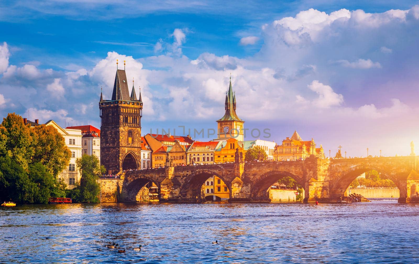 Prague in a sunny day, view of the old town, Prague, Czech Republic. Scenic summer view of the Old Town pier architecture and Charles Bridge over Vltava river in Prague, Czech Republic