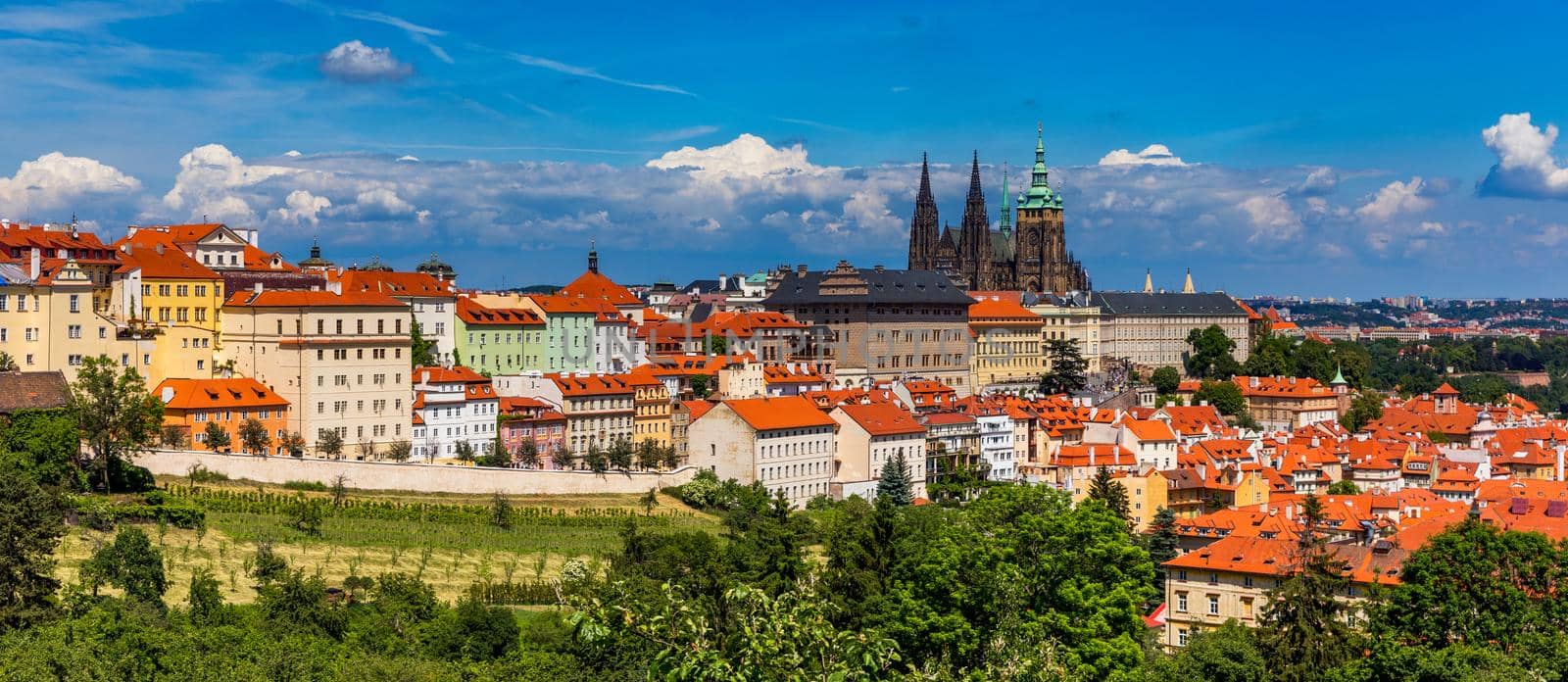 Prague in a sunny day, view of the old town, Prague, Czech Republic. Scenic summer view of the Old Town pier architecture and Charles Bridge over Vltava river in Prague, Czech Republic