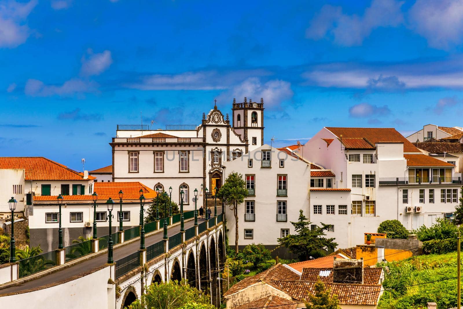 View of Nordeste on Sao Miguel Island, Azores. Old stone arch bridge in Nordeste village, Sao Miguel, Azores. Nordeste village with white town buildings on the island of Sao Miguel, Azores, Portugal.