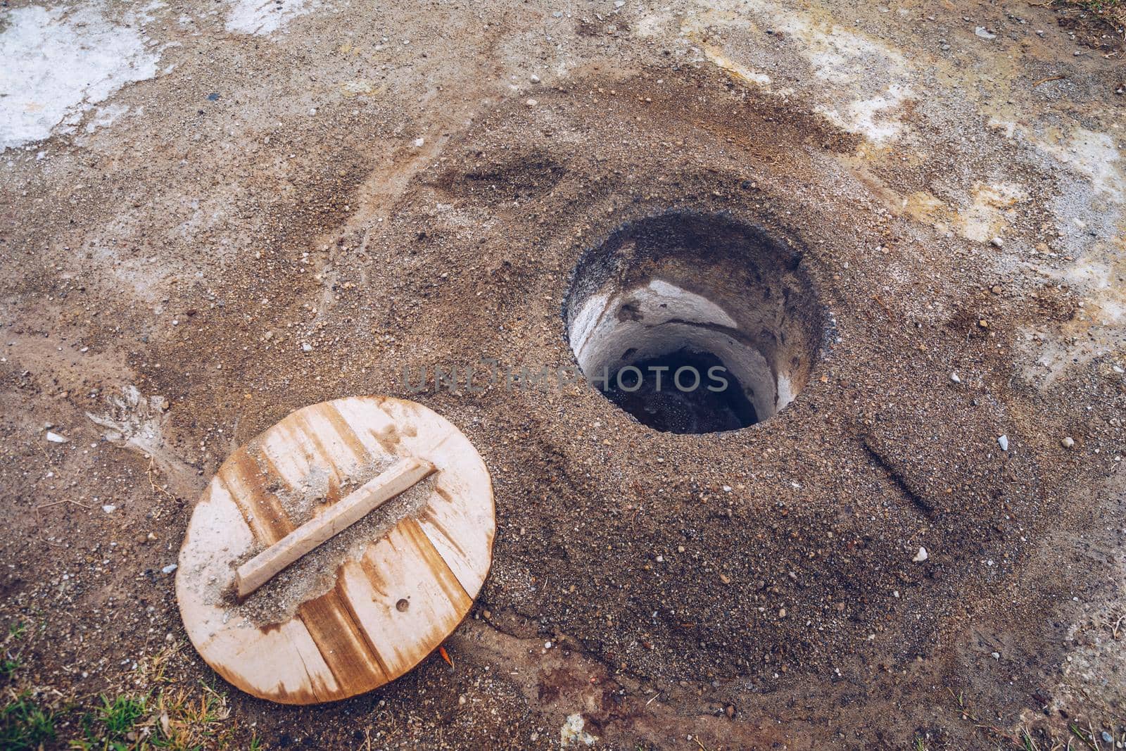 Cooking of Cozido Das Furnas meal, Sao Miguel, Azores. Hole in the ground for cooking Cozido das Furnas, a meat stew cooked by the volcanic steam from Furnas Lake, Sao Miguel, Azores, Portugal. 