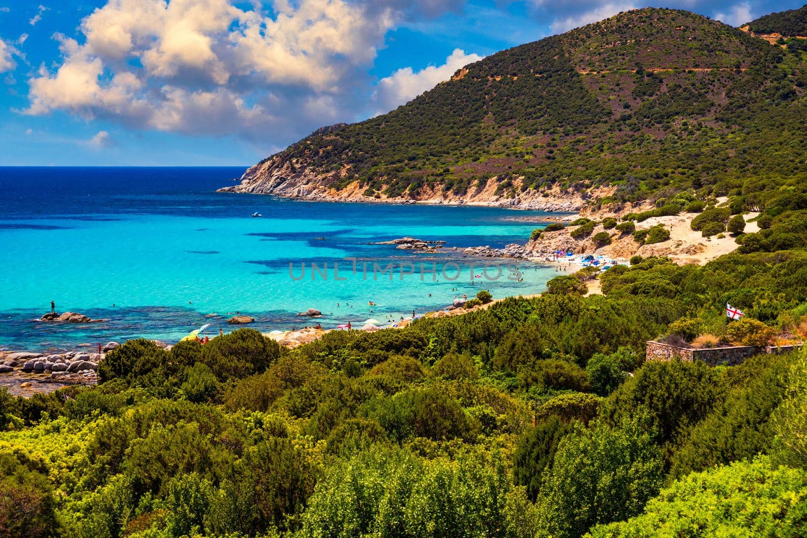 The beautiful turquoise water and white sand of Piscadeddus Beach, near Villasimius, Sardinia. The beautiful turquoise water and white sand of Piscadeddus Beach, near Villasimius, Sardinia.