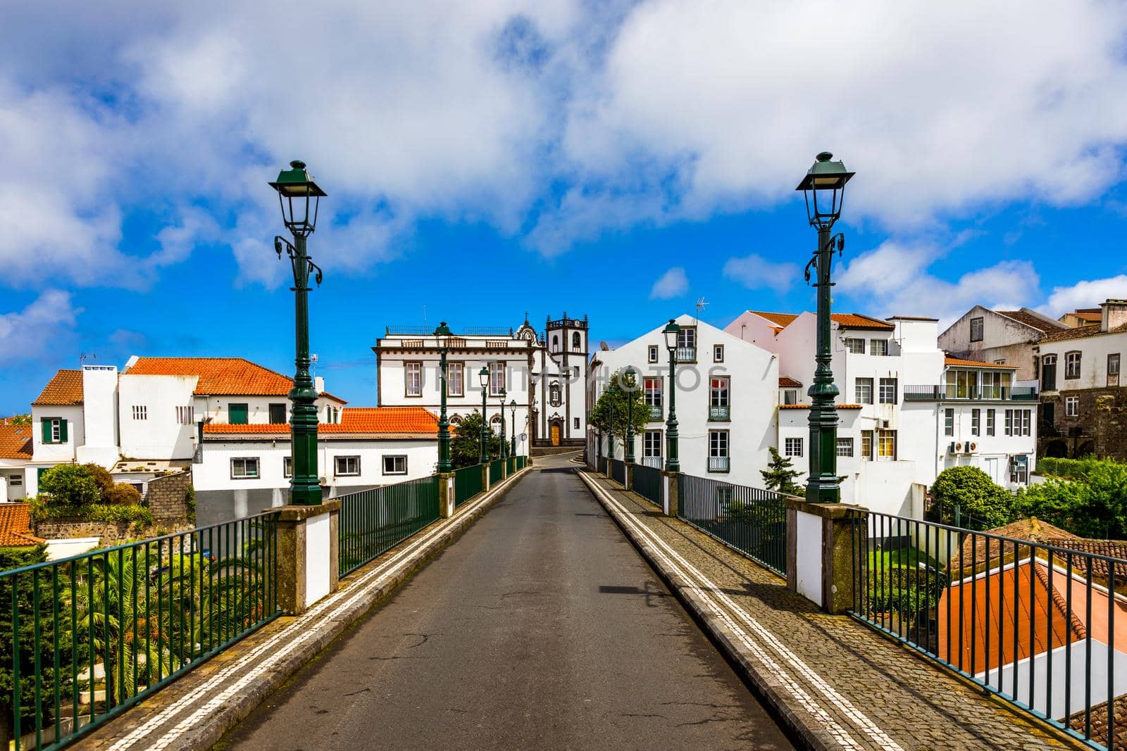 View of Nordeste on Sao Miguel Island, Azores. Old stone arch bridge in Nordeste village, Sao Miguel, Azores. Nordeste village with white town buildings on the island of Sao Miguel, Azores, Portugal.