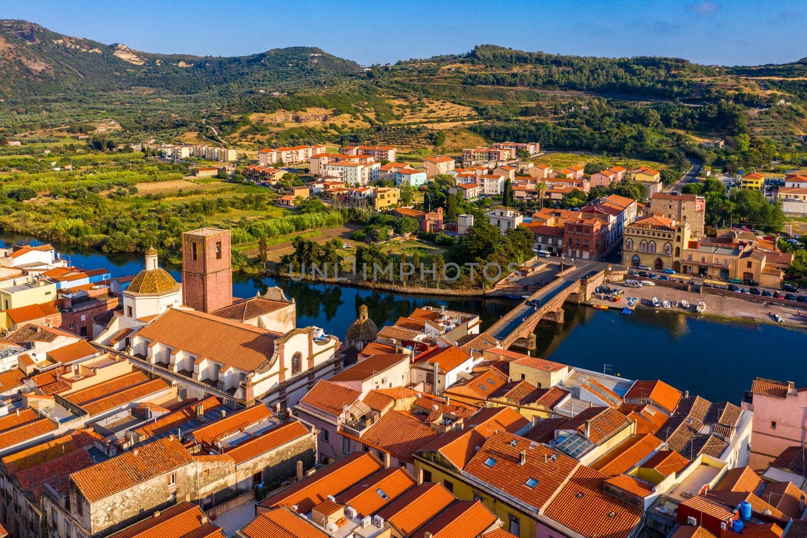 Aerial view of the beautiful village of Bosa with colored houses and a medieval castle. Bosa is located in the north-wesh of Sardinia, Italy. Aerial view of colorful houses in Bosa village, Sardegna.