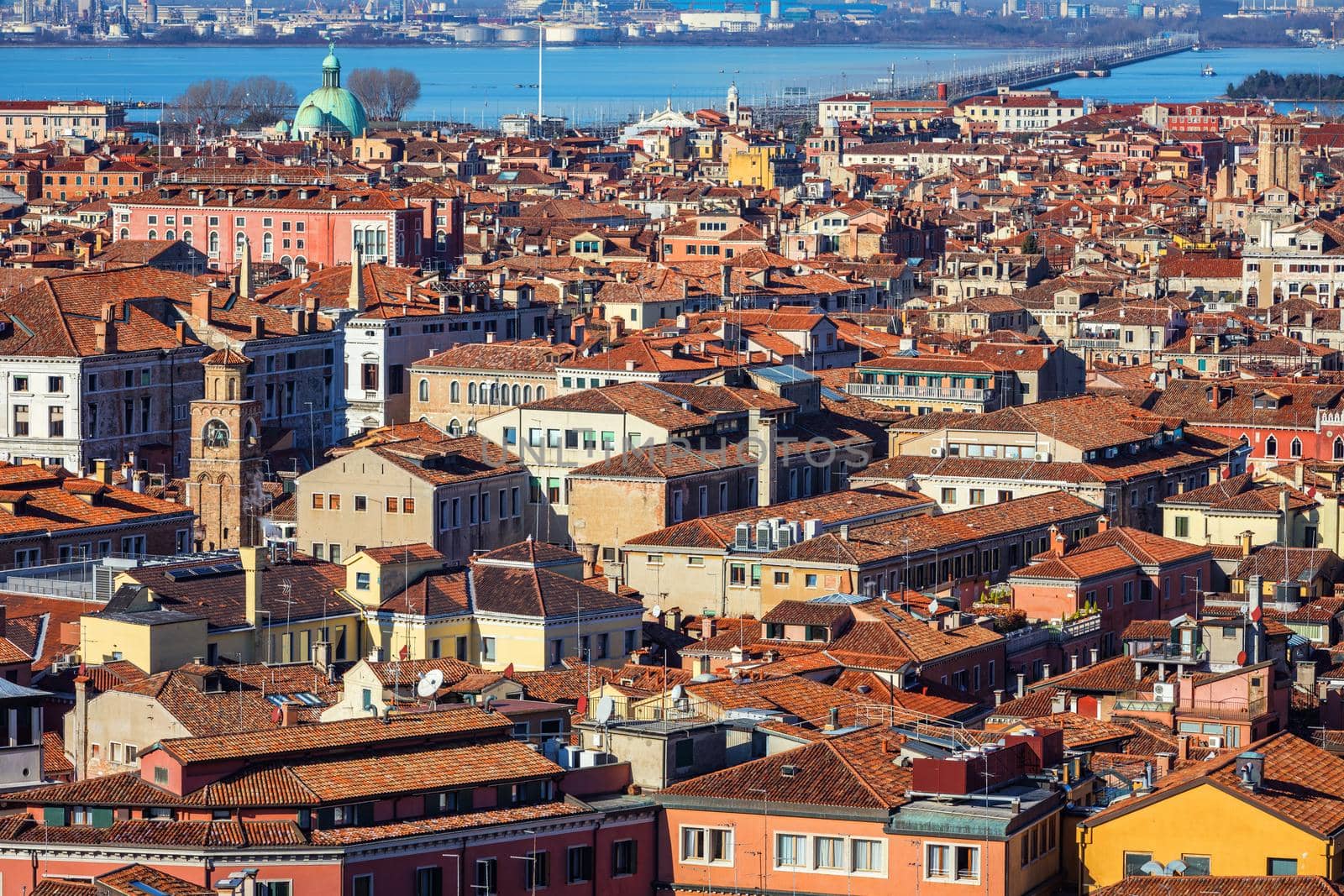 Venice panoramic aerial view with red roofs, Veneto, Italy. Aerial view of the Venice city, Italy. Venice is a popular tourist destination of Europe. Venice, Italy.
