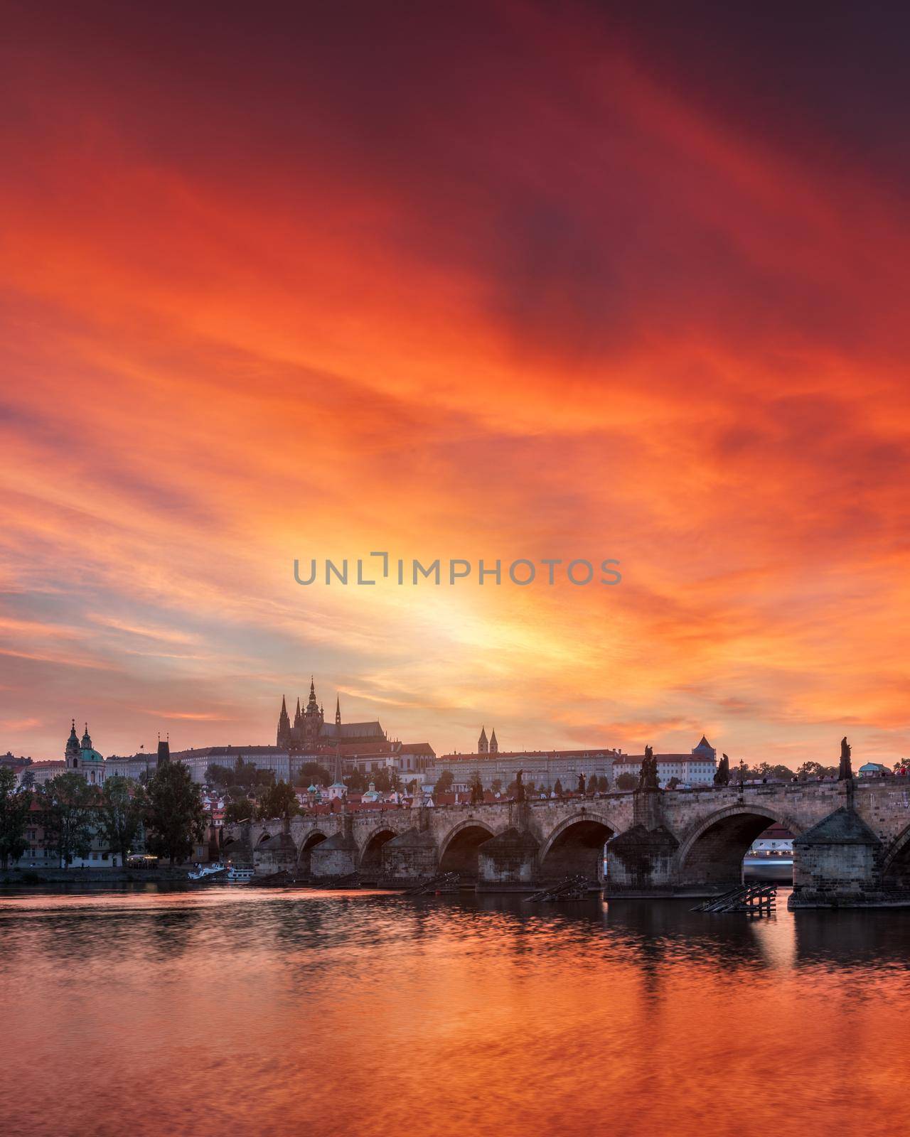 Charles Bridge at sunset with colorful sky, Prague, Czech Republic. Prague old town and iconic Charles bridge and Castle, Czech Republic. Charles Bridge (Karluv Most), Old Town Tower and Castle.