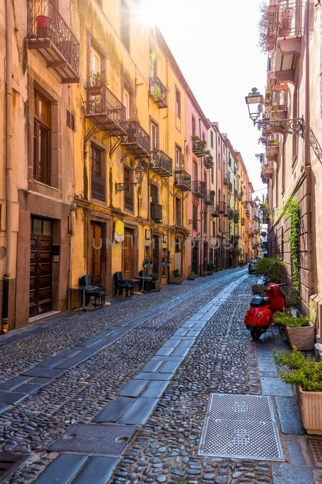 Street view of the beautiful village of Bosa with colored houses and a medieval castle. Bosa is located in the north-wesh of Sardinia, Italy. Street view of colorful houses in Bosa village, Sardegna.