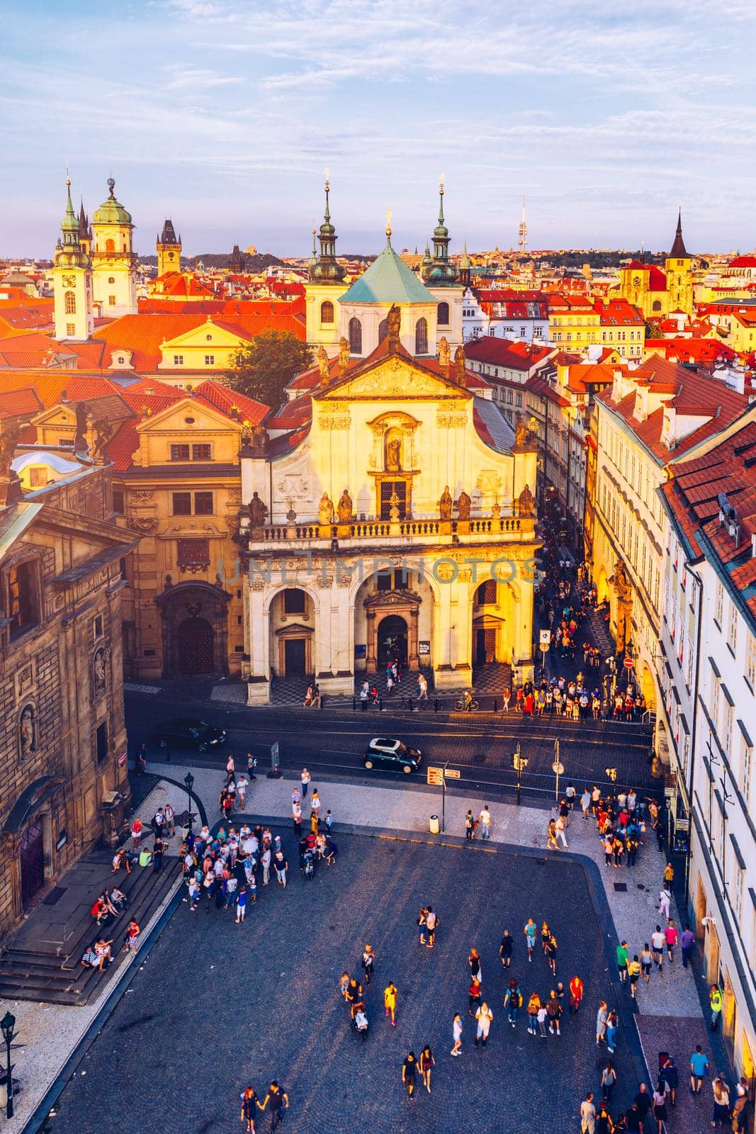 Scenic summer aerial panorama of the Old Town architecture in Prague, Czech Republic. Red roof tiles panorama of Prague old town.  Prague Old Town Square houses with traditional red roofs. Czechia.