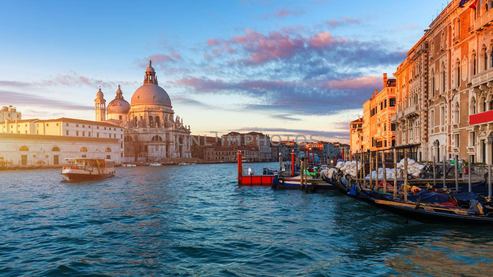Santa Maria della Salute at Sunrise in Venice, Italy. Canal Grande sunrise of Accademia's bridge. Venice, Italy. Venetian background.