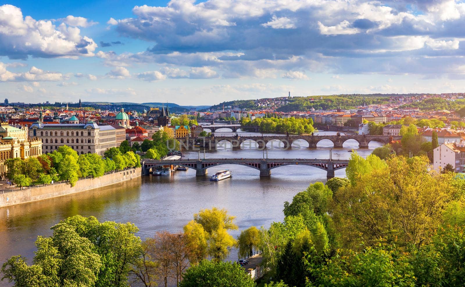 Old town of Prague. Czech Republic over river Vltava with Charles Bridge on skyline. Prague panorama landscape view with red roofs.  Prague view from Letna Park, Prague, Czechia.