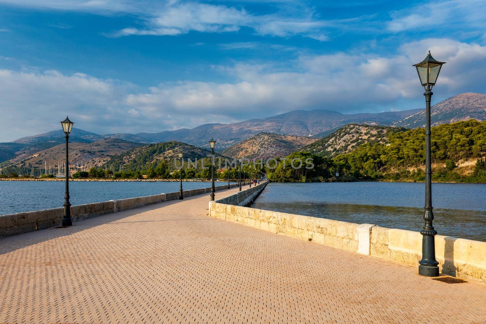 View of the De Bosset Bridge in Argostoli city on Kefalonia island. De Bosset Bridge on lakeside In Argostoli, Kefalonia. Obelisk and the de Bosset bridge in Argostoli, Kefalonia, Greece
