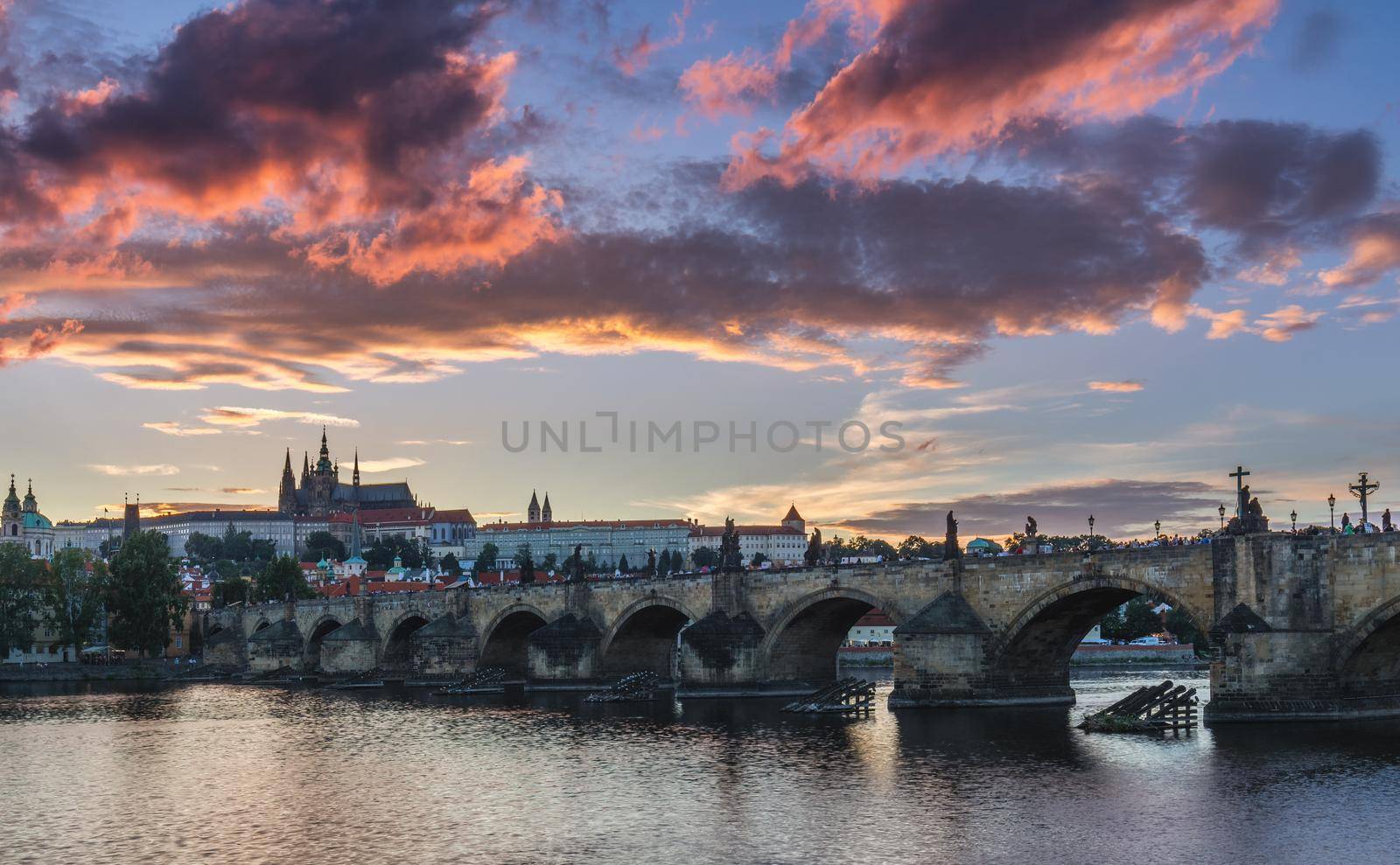 View of Prague Castle and Charles Bridge at sunset. Czechia