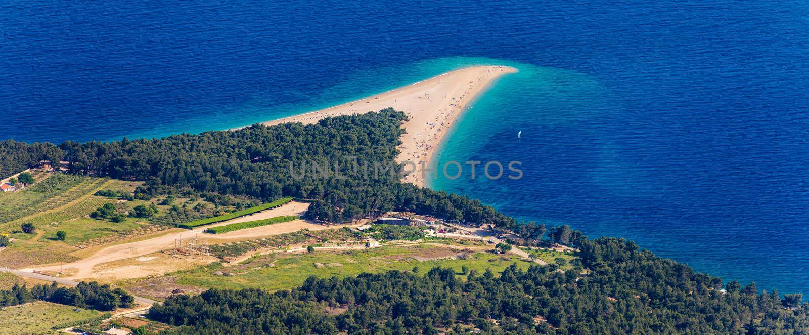 Zlatni Rat (Golden Cape or Golden Horn) famous turquoise beach in Bol town on Brac island, Dalmatia, Croatia. Zlatni Rat sandy beach at Bol on Brac island of Croatia in summertime.