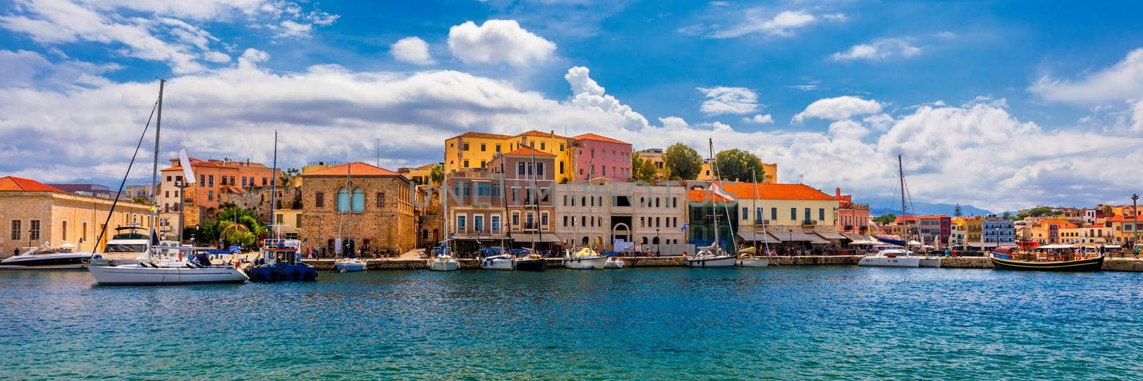 Picturesque old port of Chania. Landmarks of Crete island. Greece. Bay of Chania at sunny summer day, Crete Greece. View of the old port of Chania, Crete, Greece. The port of chania, or Hania. 