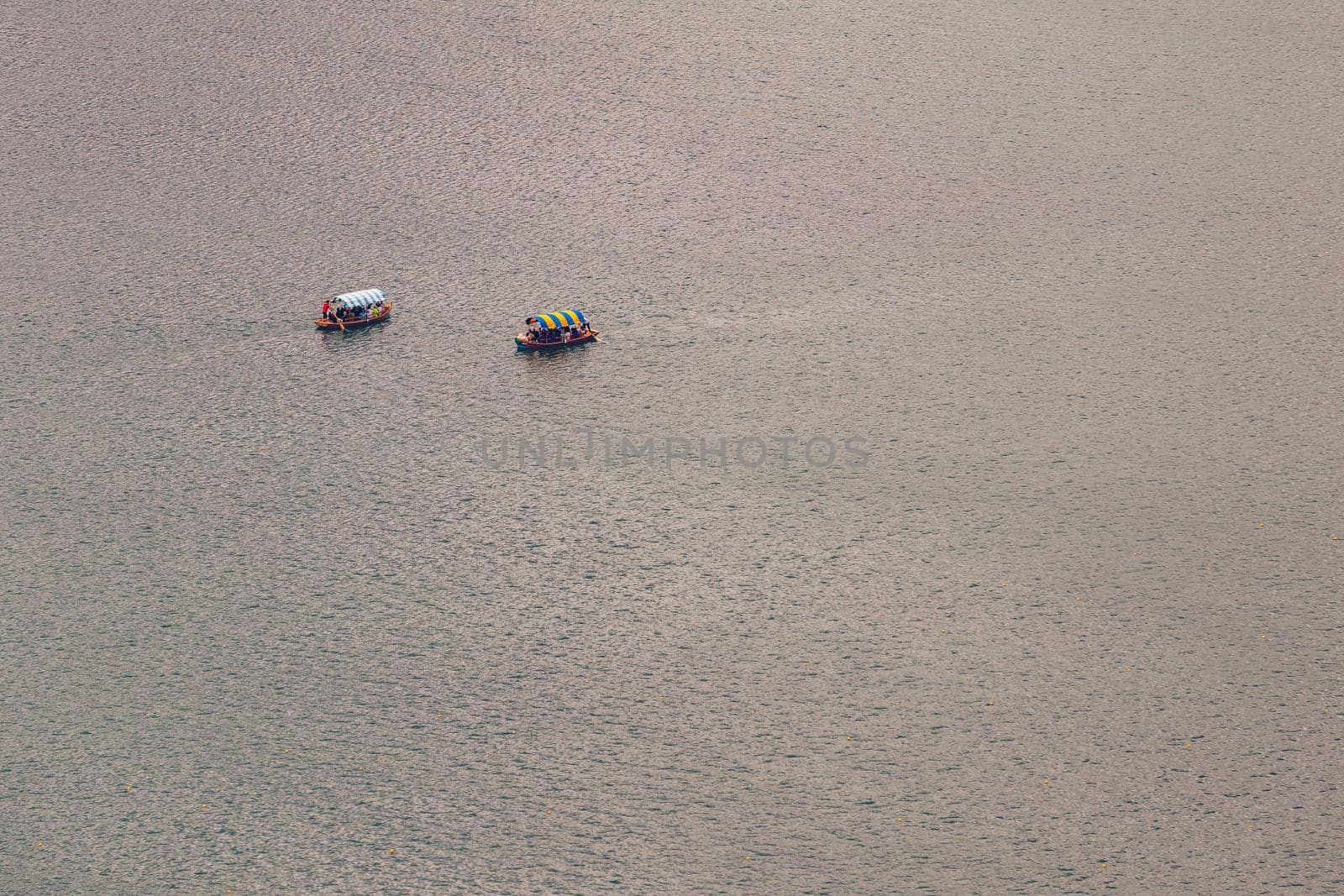 Lake Bled, Slovenia. Top view of a boat sailing in the lake. Bled lake is the most famous lake in Slovenia. Bled, Slovenia.