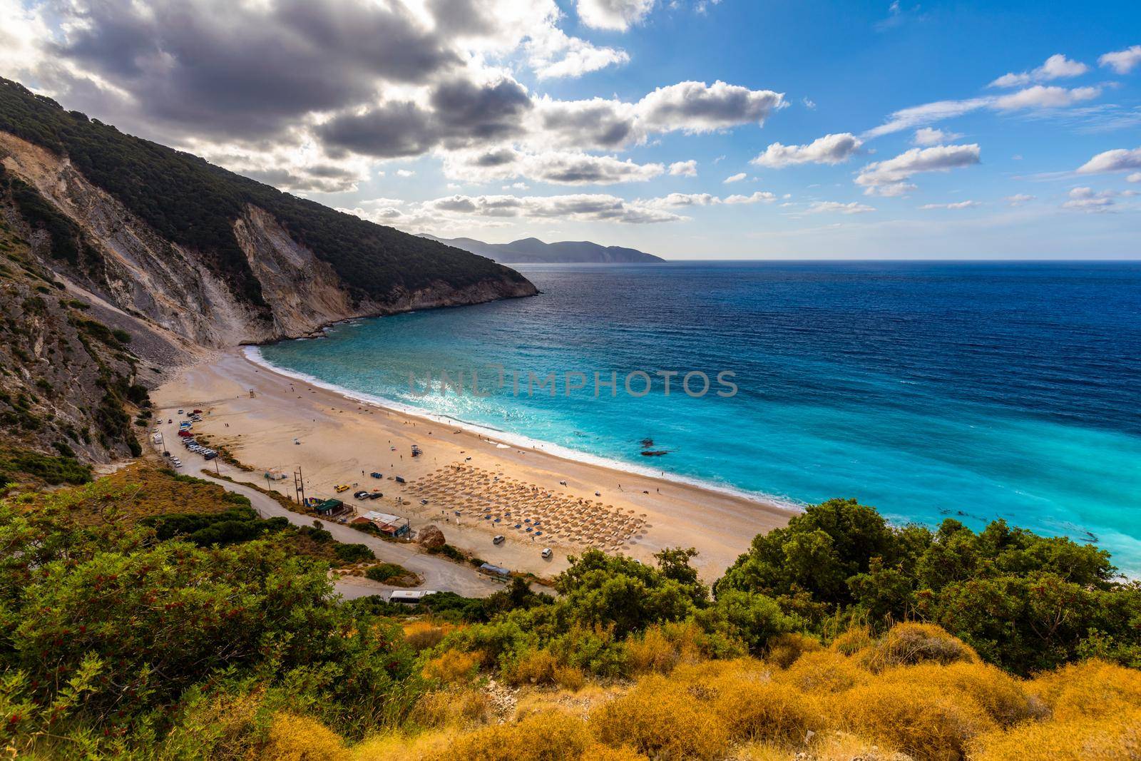 Aerial drone view of iconic turquoise and sapphire bay and beach of Myrtos, Kefalonia (Cephalonia) island, Ionian, Greece. Myrtos beach, Kefalonia island, Greece. Beautiful view of Myrtos beach.