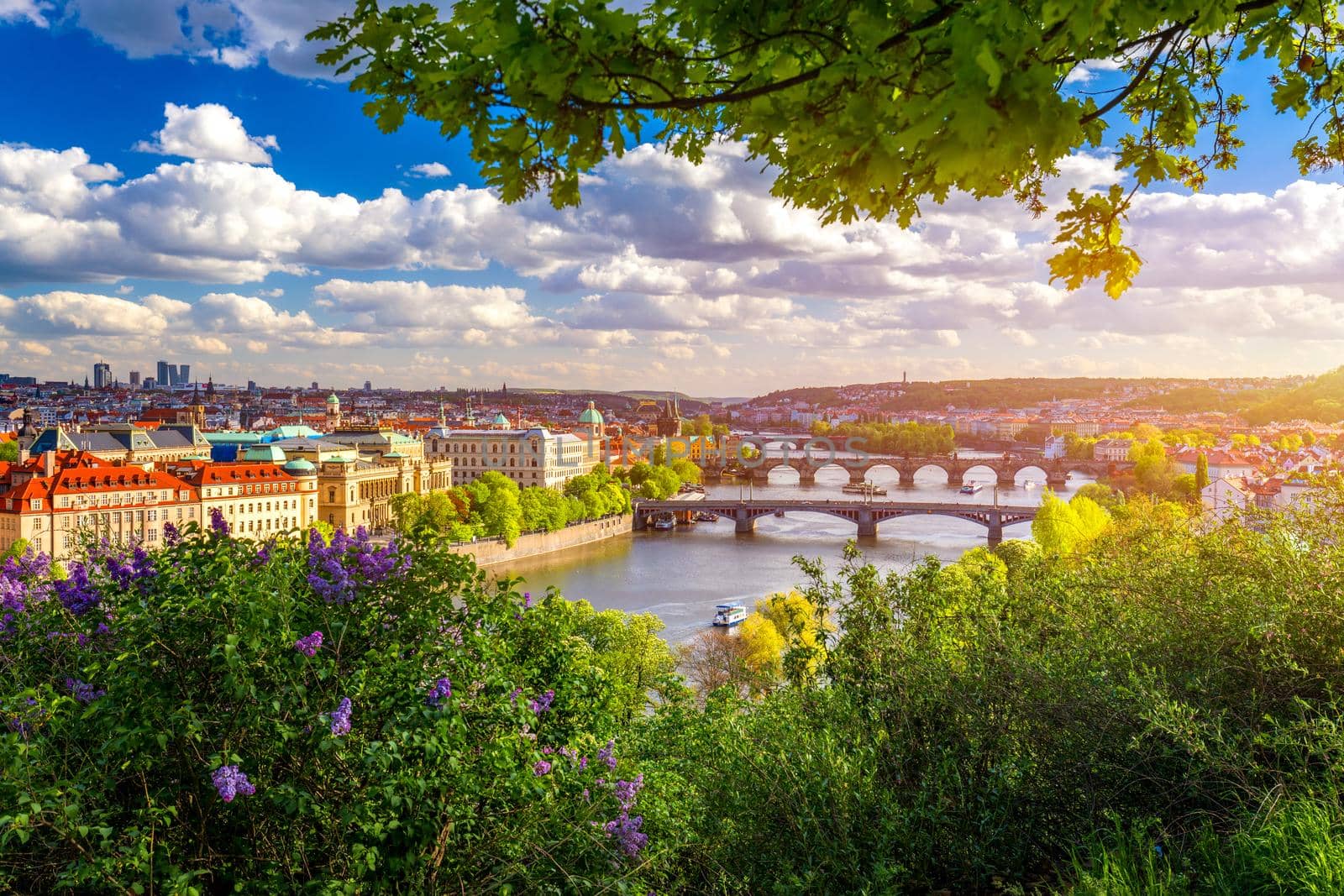 Scenic view of the Old Town pier architecture and Charles Bridge over Vltava river in Prague, Czech Republic. Prague iconic Charles Bridge (Karluv Most) and Old Town Bridge Tower at sunset, Czechia.