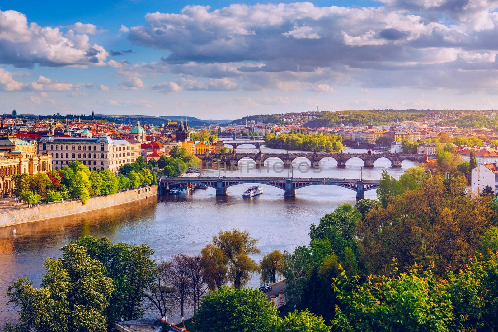 Autumn view to Charles bridge on Vltava river in Prague, Czech Republic. Autumn view to Charles Bridge, Prague old town and Vltava river from popular view point in the Letna park (Letenske sady).