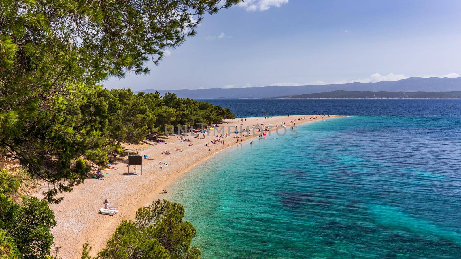 Zlatni Rat (Golden Cape or Golden Horn) famous turquoise beach in Bol town on Brac island, Dalmatia, Croatia. Zlatni Rat sandy beach at Bol on Brac island of Croatia in summertime.
