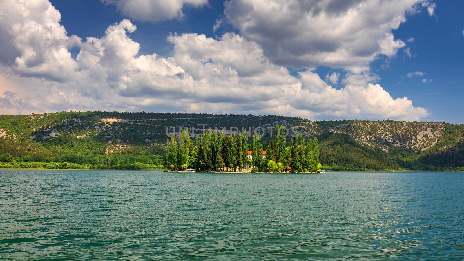 Island of Visovac monastery in Krka national park, Dalmatia, Croatia. Visovac christian monastery on the island in The Krka National park, Croatia.