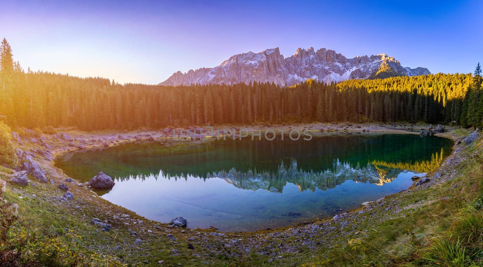 Carezza lake (Lago di Carezza, Karersee) with Mount Latemar, Bolzano province, South tyrol, Italy. Landscape of Lake Carezza or Karersee and Dolomites in background, Nova Levante, Bolzano, Italy.