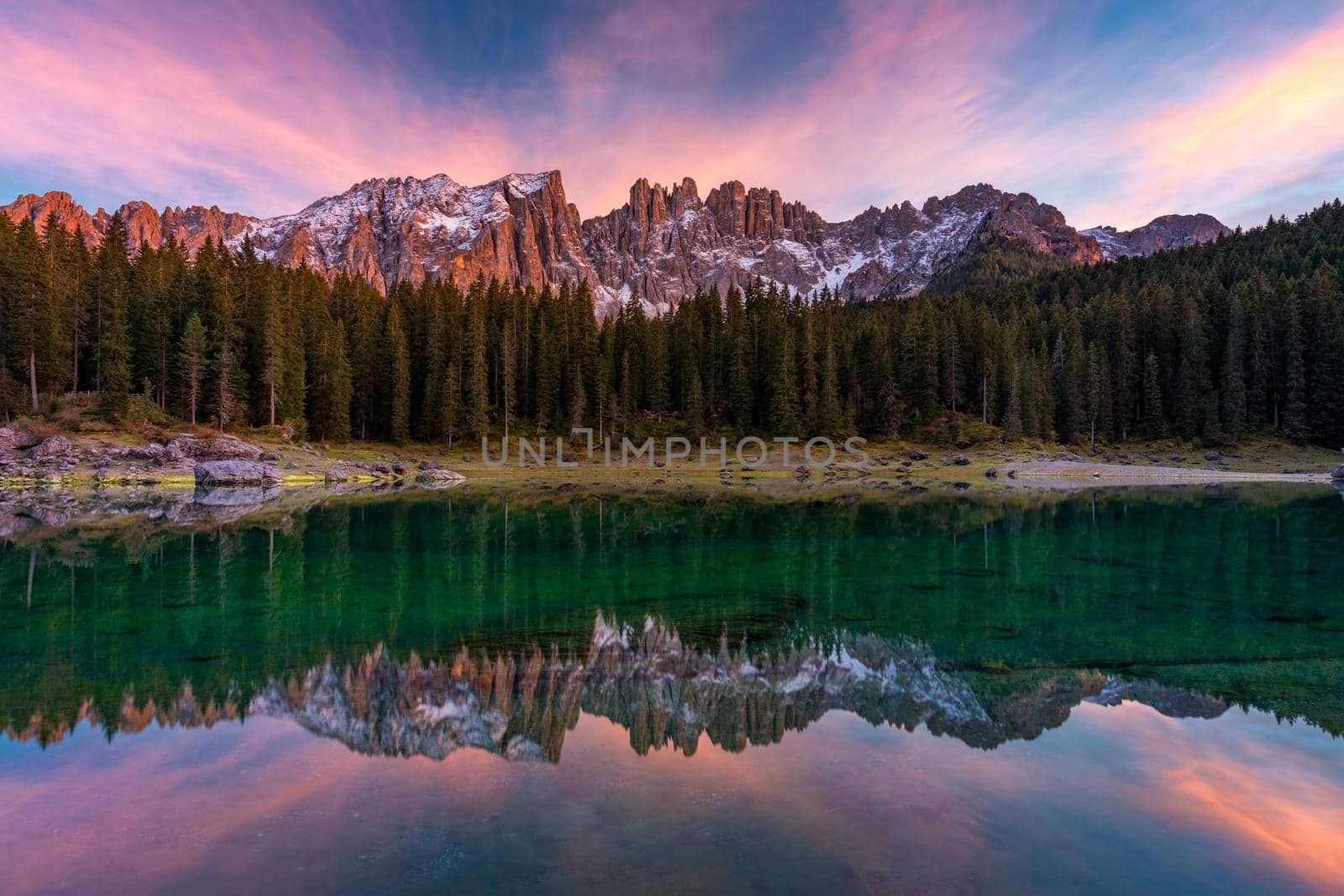 Carezza lake (Lago di Carezza, Karersee) with Mount Latemar, Bolzano province, South tyrol, Italy. Landscape of Lake Carezza or Karersee and Dolomites in background, Nova Levante, Bolzano, Italy.