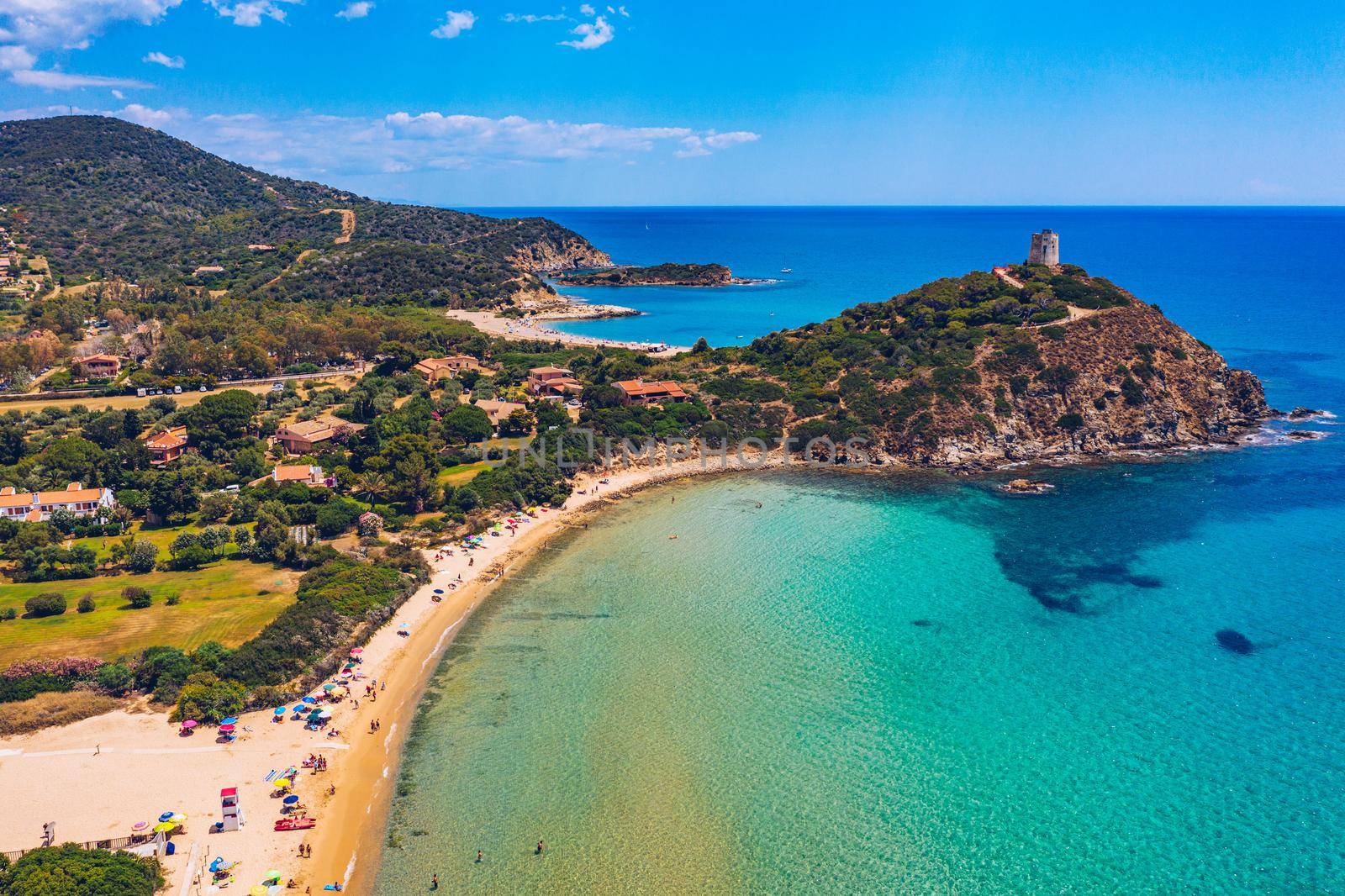 Torre di Chia view from flying drone. Acropoli di Bithia with Torre di Chia tower on background. Aerial view of Sardinia island, Italy, Europe. Panorama Of Chia Coast, Sardinia, Italy. 