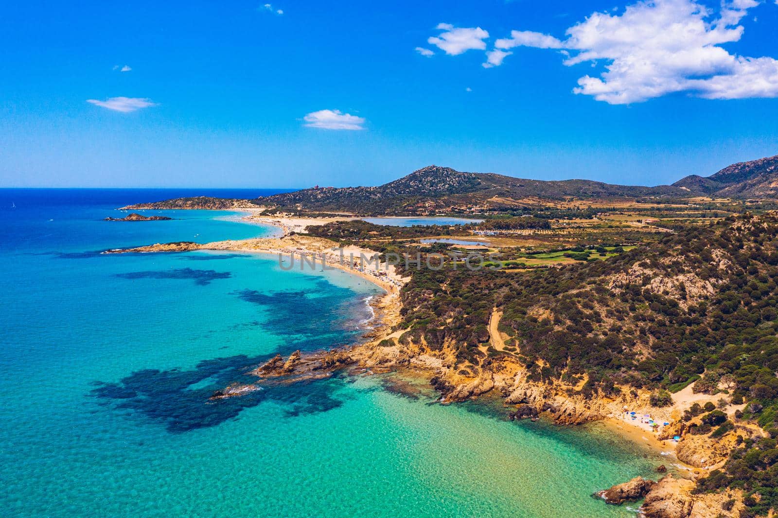 Panorama of the wonderful beaches of Chia, Sardinia, Italy. View of beautiful Chia bay and wonderful beaches, Sardinia island, Italy. Beautiful sea and bay on Su Guideu beach, Sardinia island, Italy