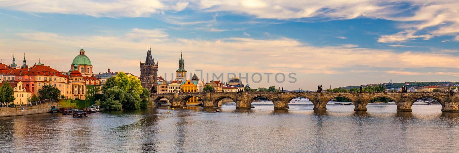 Scenic view on Vltava river and historical center of Prague, buildings and landmarks of old town, Prague, Czech Republic. Charles Bridge (Karluv Most) and Lesser Town Tower, Prague, Czechia