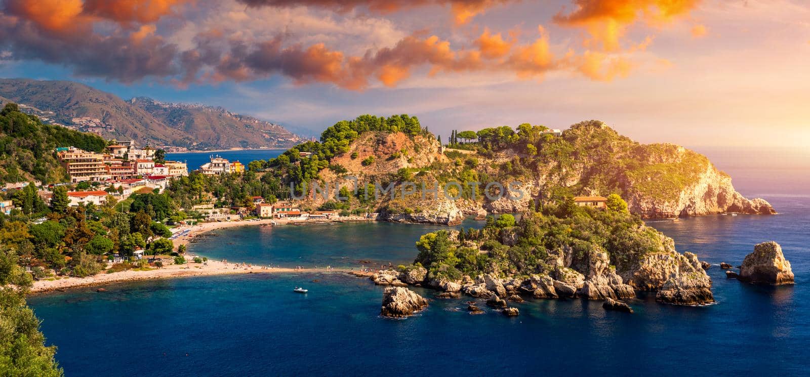 Aerial view of Isola Bella in Taormina, Sicily, Italy. Isola Bella is small island near Taormina, Sicily, Italy. Narrow path connects island to mainland Taormina beach in azure waters of Ionian Sea. 