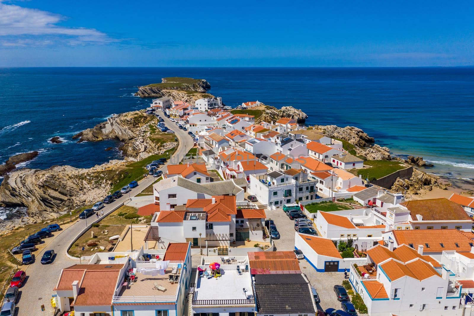 Aerial view of island Baleal naer Peniche on the shore of the ocean in west coast of Portugal. Baleal Portugal with incredible beach and surfers. Aerial view of Baleal, Portugal.