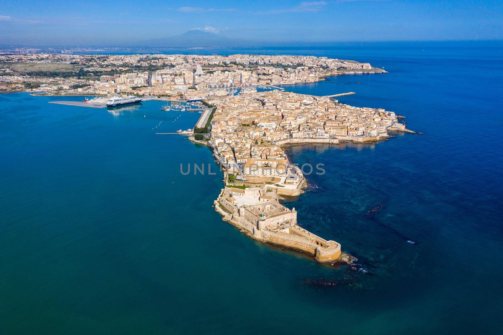 Siracusa, Ortigia Island from the air, Sicily, Italy. Isola di Ortigia, coast of Ortigia island at city of Syracuse, Sicily, Italy. Coastline town Syracuse, Sicily and old Ortigia island. Aerial view.