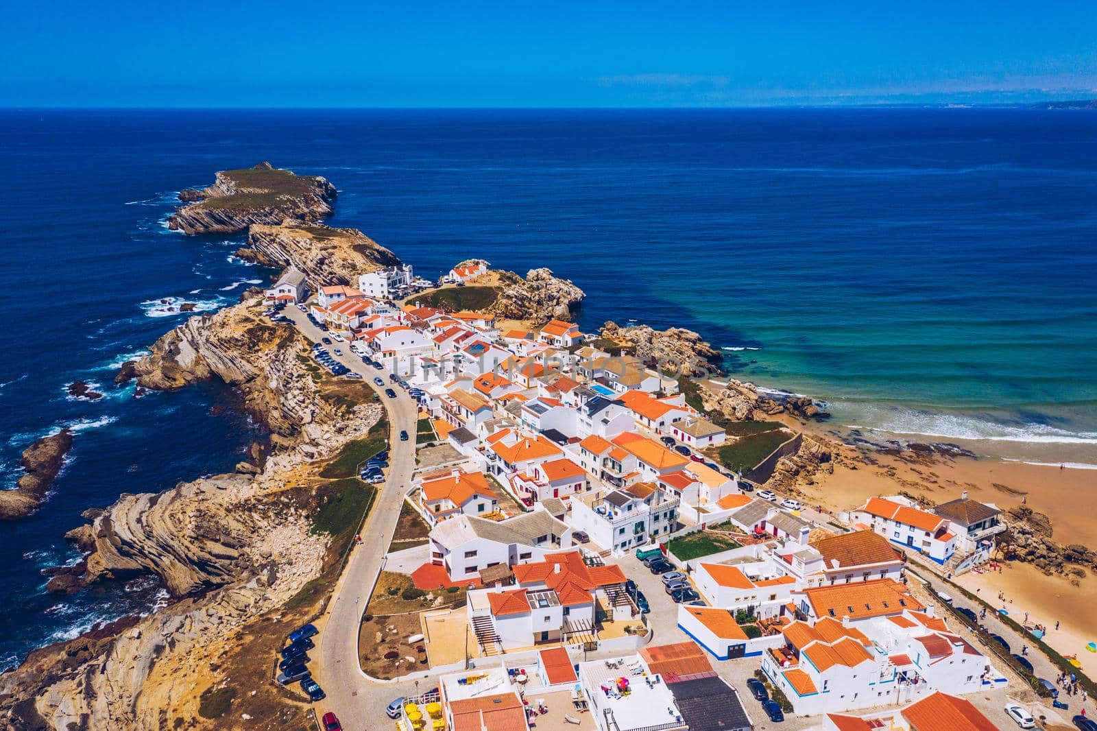 Aerial view of island Baleal naer Peniche on the shore of the ocean in west coast of Portugal. Baleal Portugal with incredible beach and surfers. Aerial view of Baleal, Portugal.