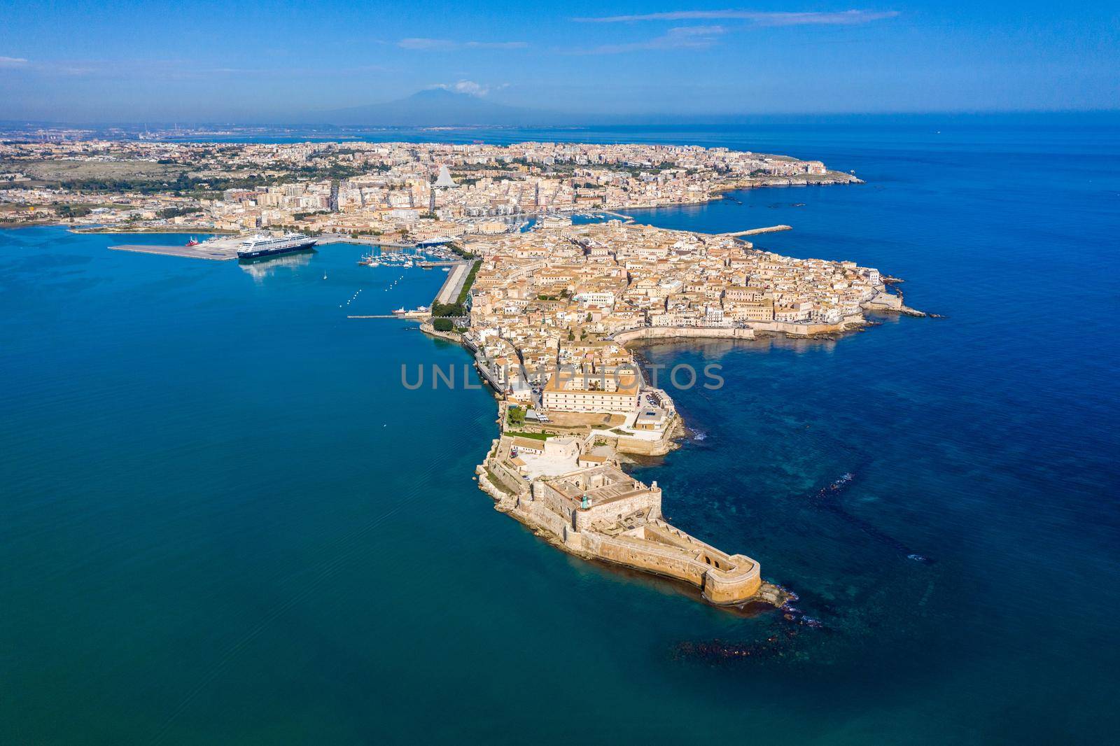 Siracusa, Ortigia Island from the air, Sicily, Italy. Isola di Ortigia, coast of Ortigia island at city of Syracuse, Sicily, Italy. Coastline town Syracuse, Sicily and old Ortigia island. Aerial view.