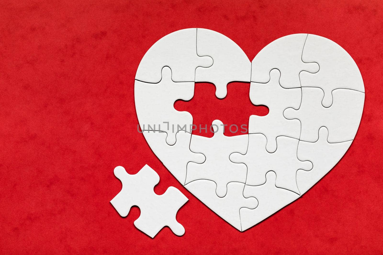 Heart object made of puzzle pieces. Make complete heart. Jigsaw puzzle pieces in form of heart. Happy Valentines Day, greeting card template. Heart jigsaw puzzle.