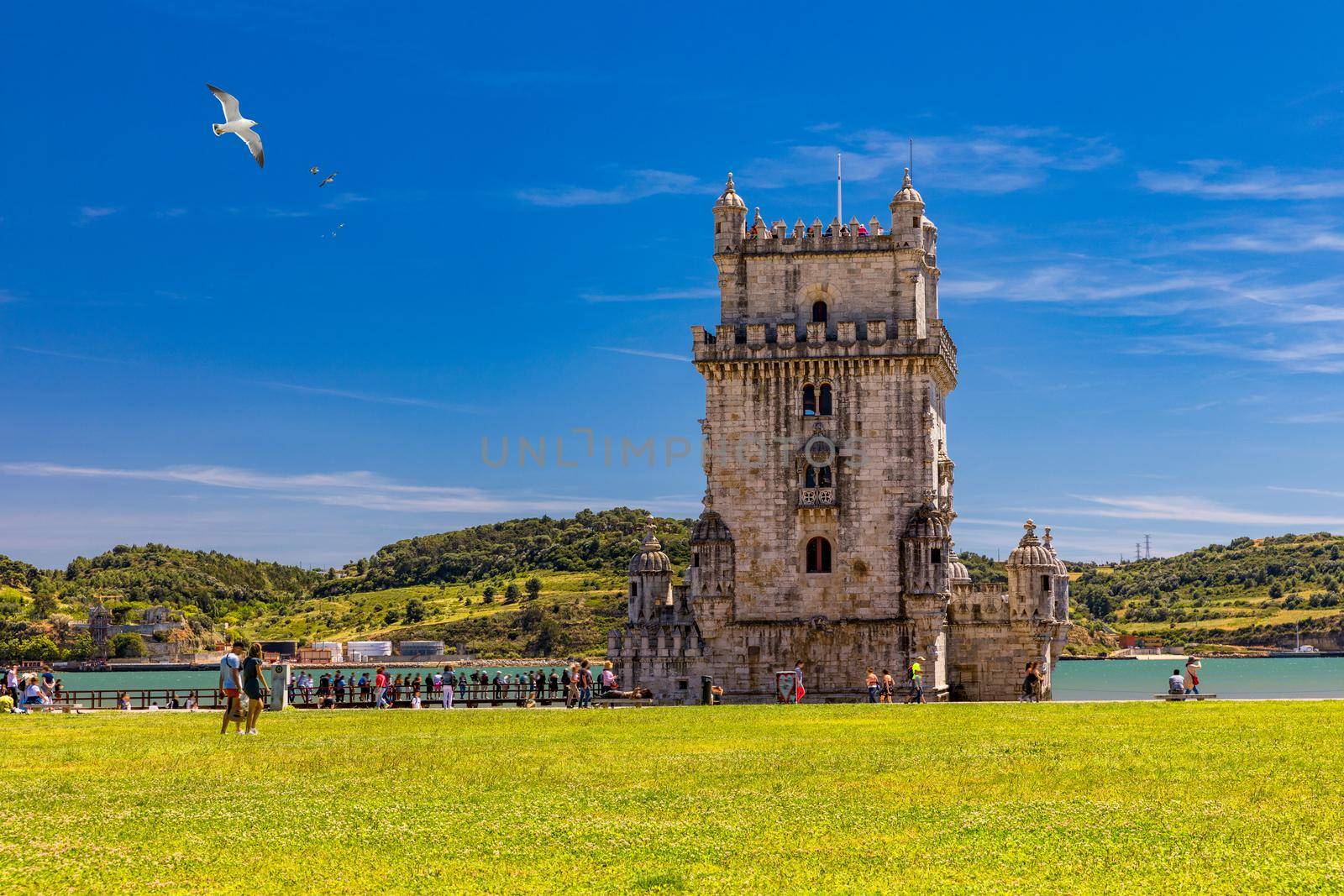 View at the Belem tower at the bank of Tejo River in Lisbon, Portugal. The Belem Tower (Torre de Belem), Lisbon, Portugal. At the margins of the Tejo river, it is an iconic site of the city. 