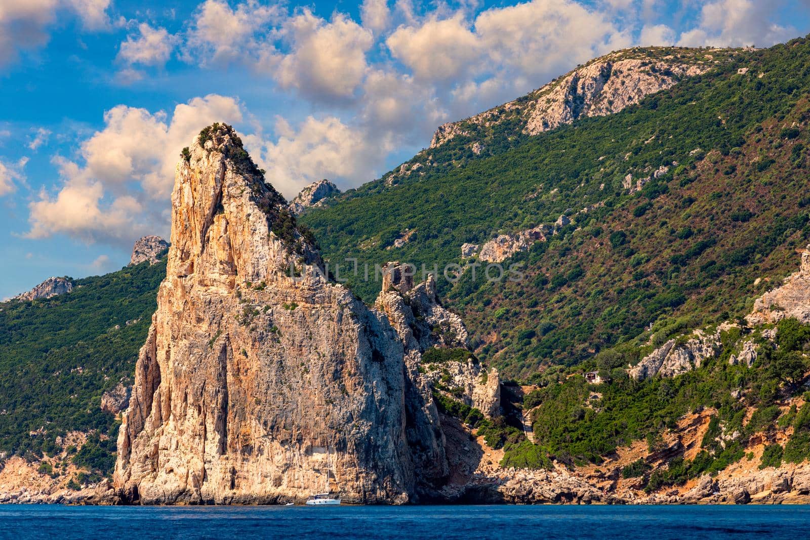 The monolith of Pedra Longa, Baunei, province of Ogliastra, East Sardinia, Italy. The rocky spire which rises majestically out of the sea. Holidays in Sardinia, Italy.