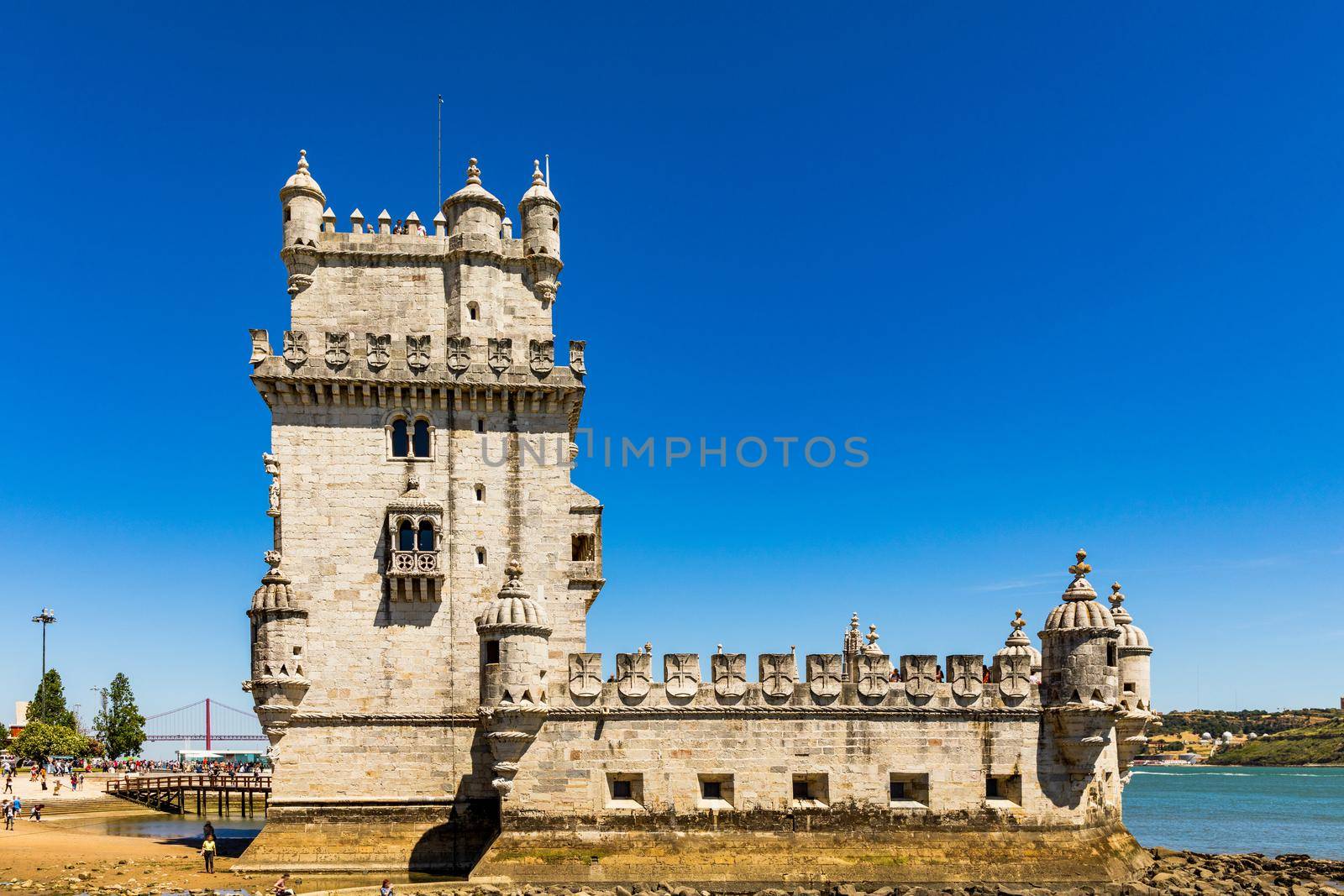 View at the Belem tower at the bank of Tejo River in Lisbon, Portugal. The Belem Tower (Torre de Belem), Lisbon, Portugal. At the margins of the Tejo river, it is an iconic site of the city. 