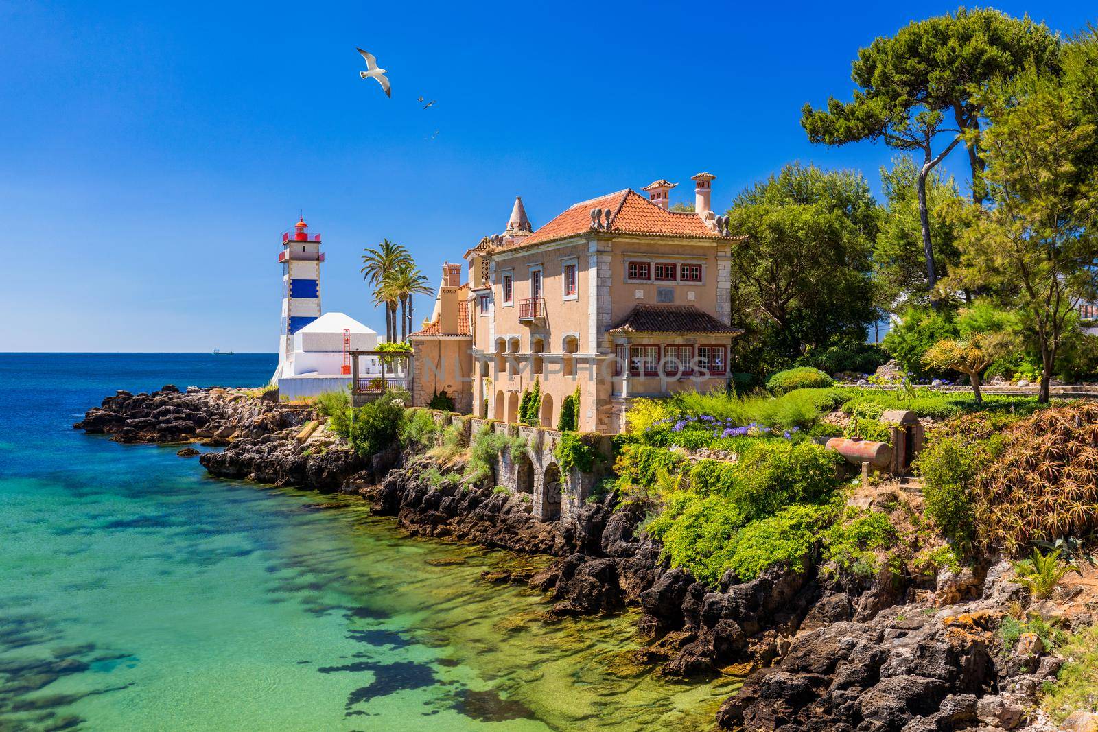 Santa Marta lighthouse and Municipal museum, Cascais, Lisbon, Portugal. Lighthouse Museum of Santa Marta in Cascais Portugal, as seen from Santa Marta Beach on a beautiful day. Cascais, Portugal.