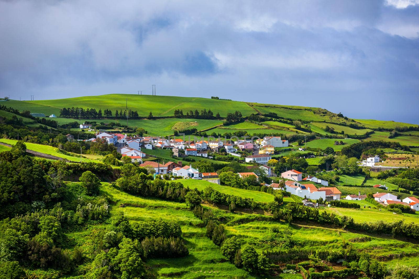 View of Pedreira village at northeast coast of Sao Miguel island, Azores, Portugal. View of Pedreira village and Pico do Bartolomeu at northeast coast of Sao Miguel island, Azores, Portugal.