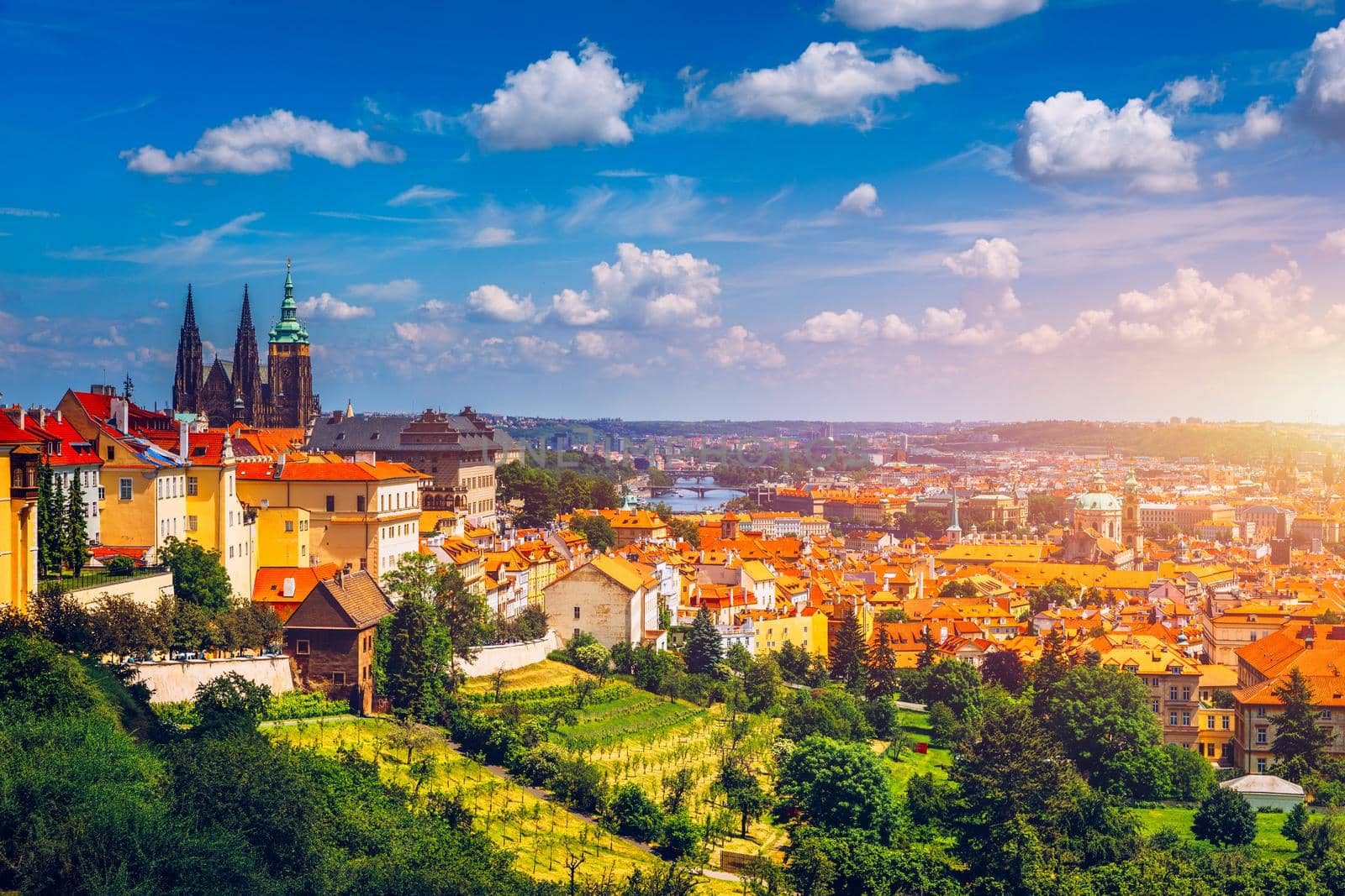 Prague in a sunny day, view of the old town, Prague, Czech Republic. Scenic summer view of the Old Town pier architecture and Charles Bridge over Vltava river in Prague, Czech Republic