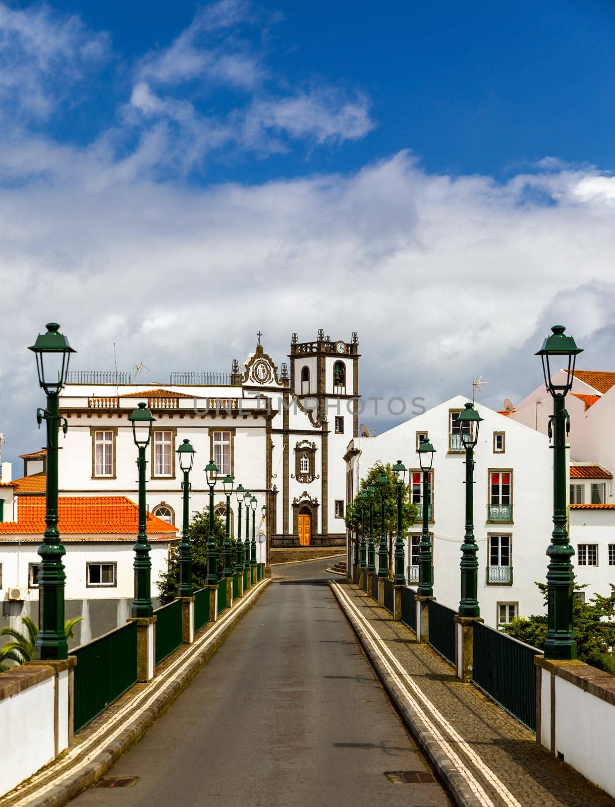 View of Nordeste on Sao Miguel Island, Azores. Old stone arch bridge in Nordeste village, Sao Miguel, Azores. Nordeste village with white town buildings on the island of Sao Miguel, Azores, Portugal.