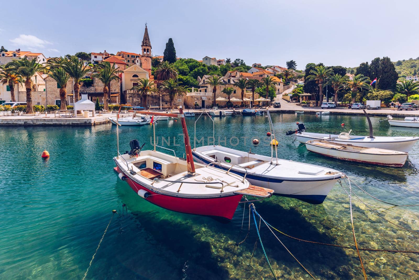 Fishing boats in Splitska village with beautiful port, Brac island, Croatia. Village of Splitska on Brac island seafront view, Dalmatia, Croatia, Croatia.