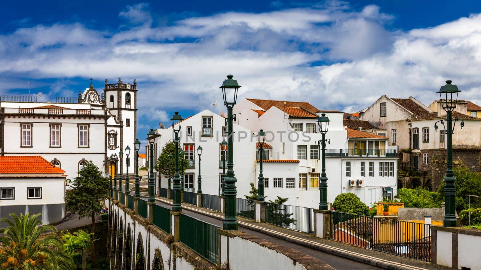 View of Nordeste on Sao Miguel Island, Azores. Old stone arch bridge in Nordeste village, Sao Miguel, Azores. Nordeste village with white town buildings on the island of Sao Miguel, Azores, Portugal.