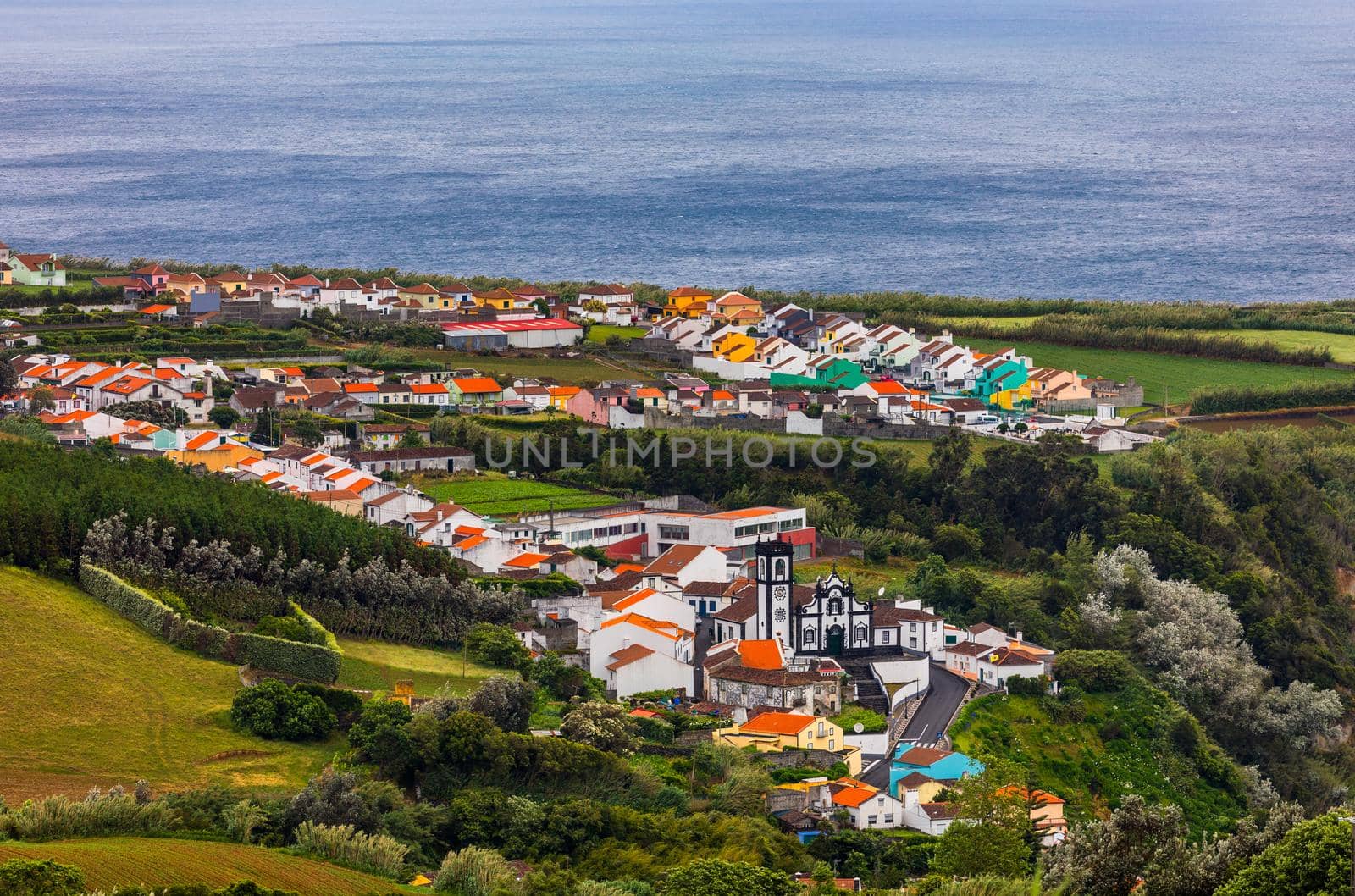 Beautiful nature view on Azores with small villages, tows, green nature fields. Amazing Azores. View of typical Azores village in Sao Miguel island, Azores, Portugal.