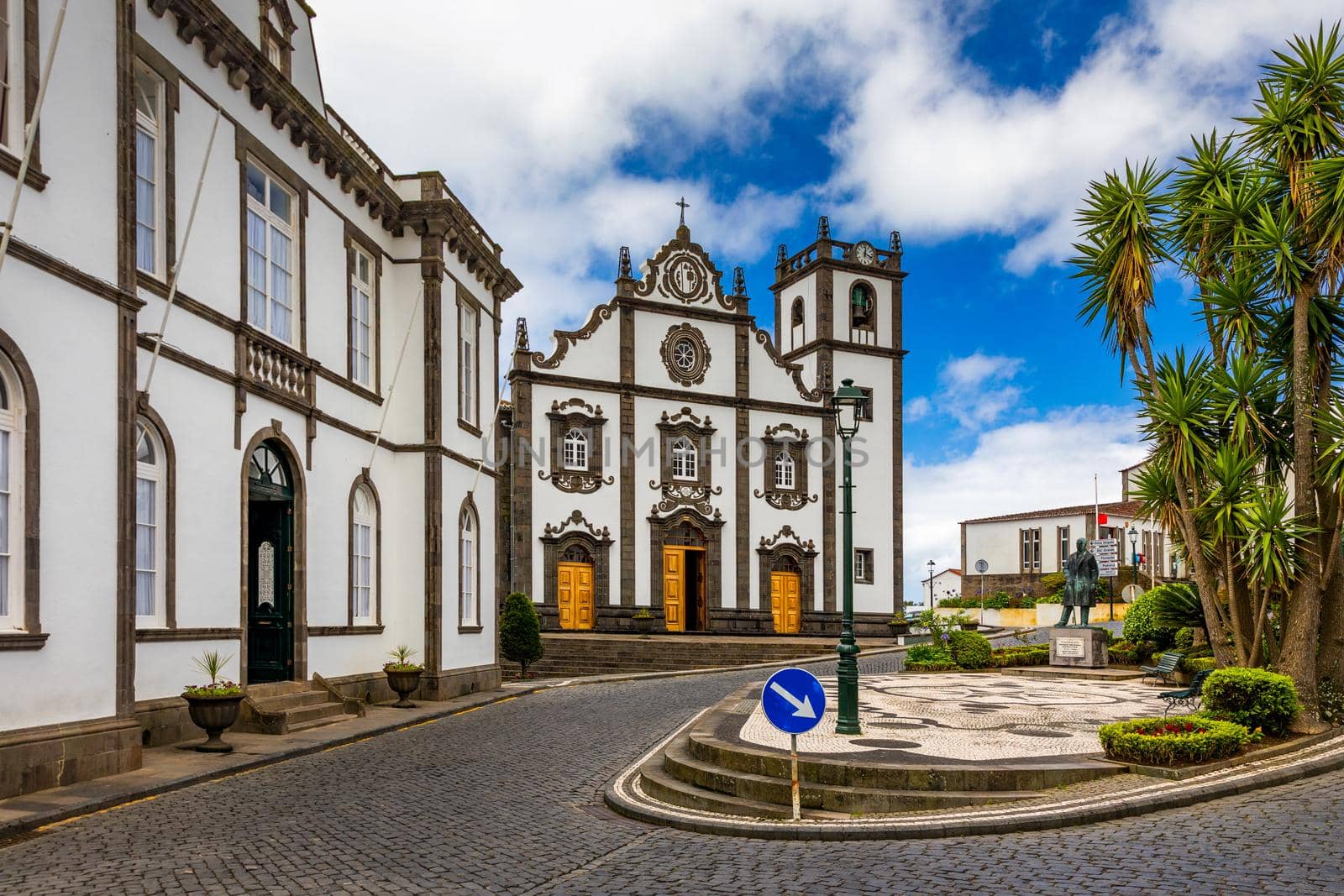 View of Nordeste on Sao Miguel Island, Azores. Old stone arch bridge in Nordeste village, Sao Miguel, Azores. Nordeste village with white town buildings on the island of Sao Miguel, Azores, Portugal.
