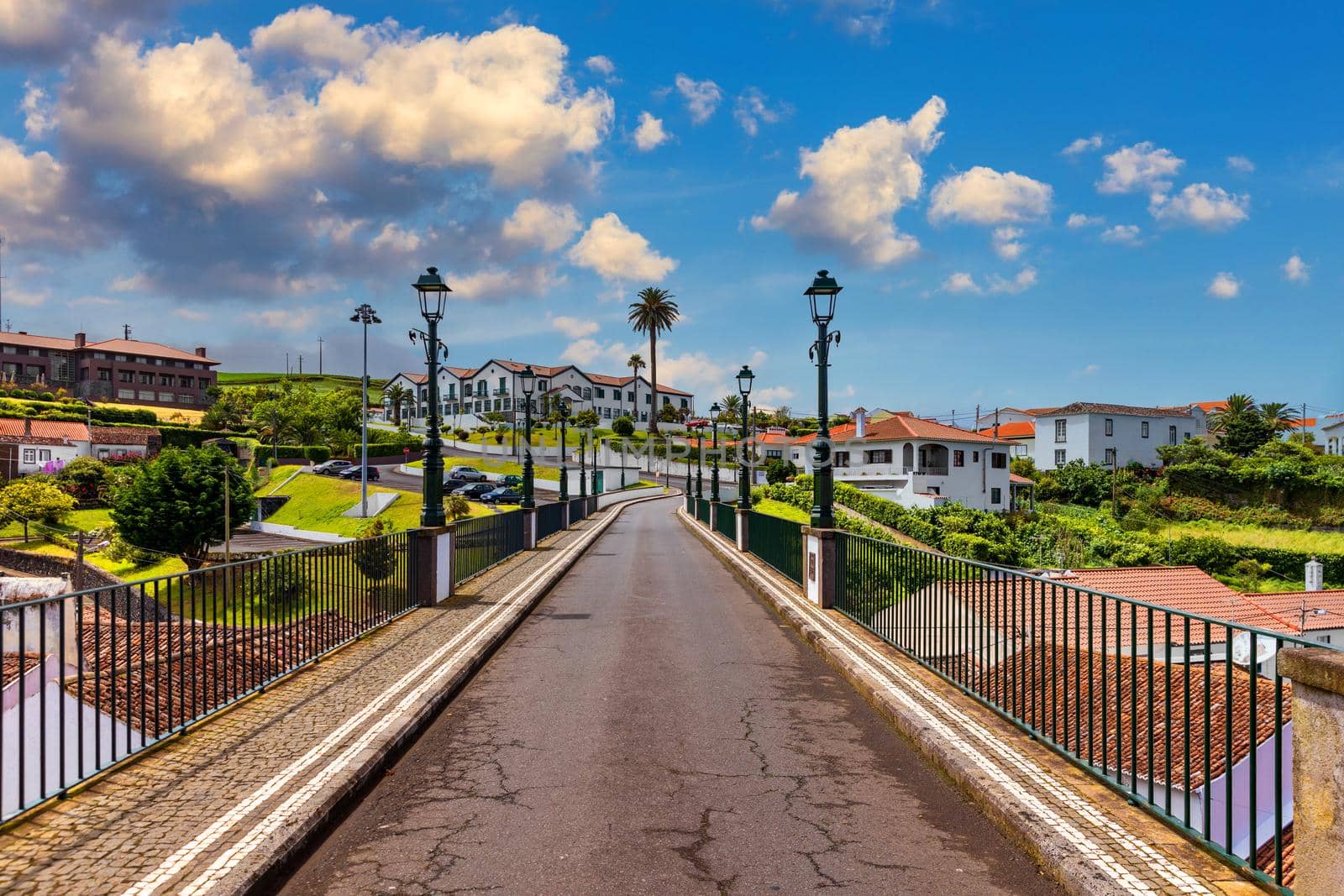 View of Nordeste on Sao Miguel Island, Azores. Old stone arch bridge in Nordeste village, Sao Miguel, Azores. Nordeste village with white town buildings on the island of Sao Miguel, Azores, Portugal.