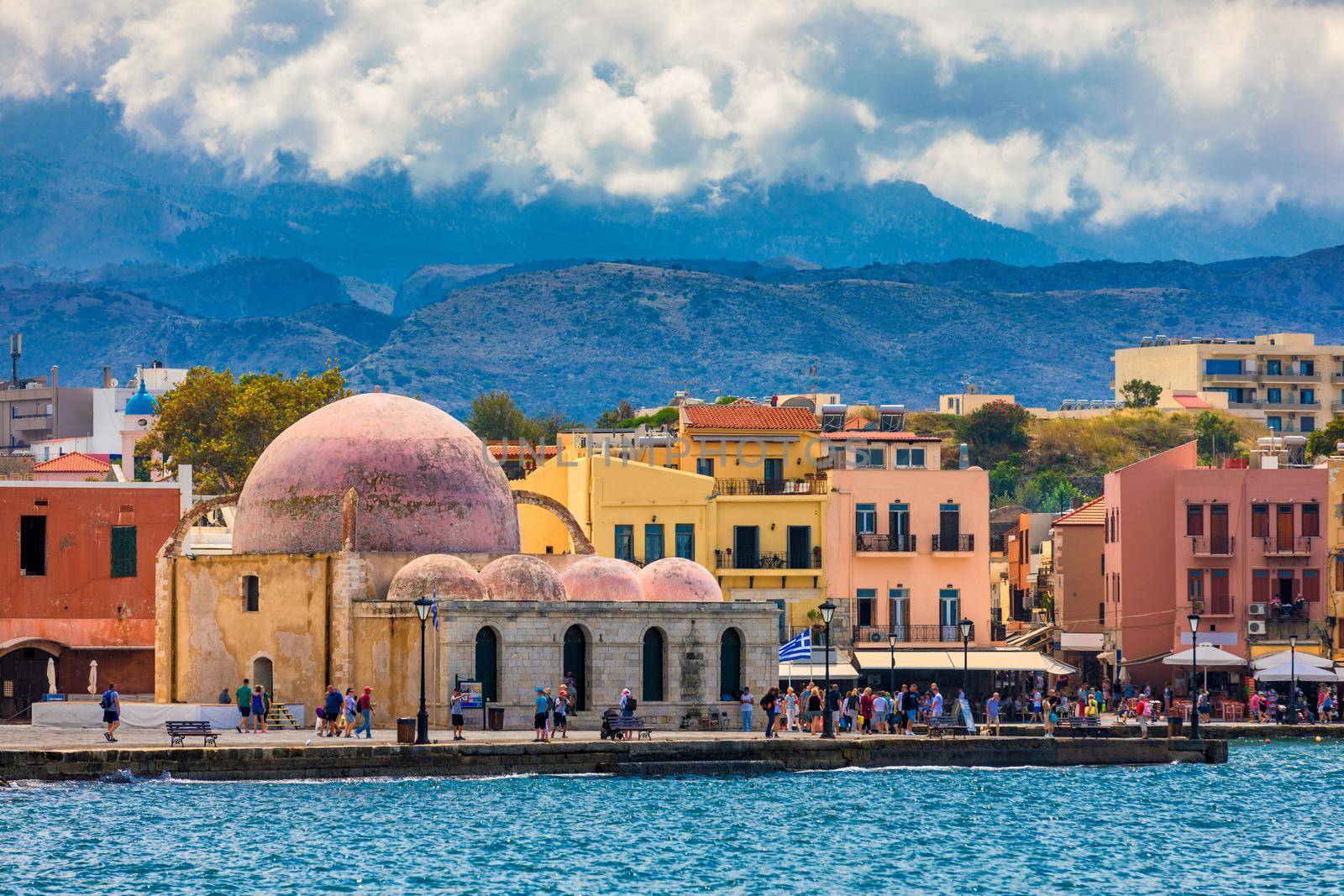 Mosque in the old Venetian harbor of Chania town on Crete island, Greece. Old mosque in Chania. Janissaries or Kioutsouk Hassan Mosque in Chania Crete. Turkish mosque in Chania bay. Crete, Greece.