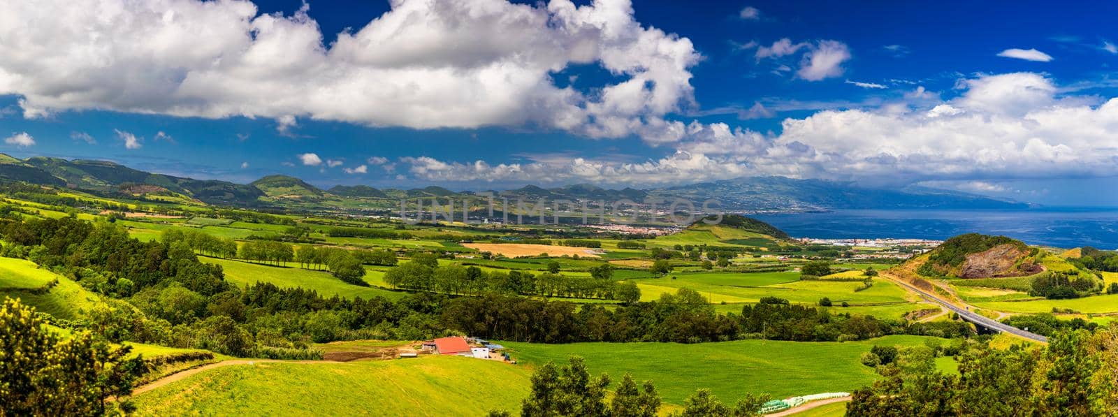 Azores panoramic view of natural landscape, wonderful scenic island of Portugal. Beautiful lagoons in volcanic craters and green fields. Tourist attraction and travel destination. Azores, Portugal.