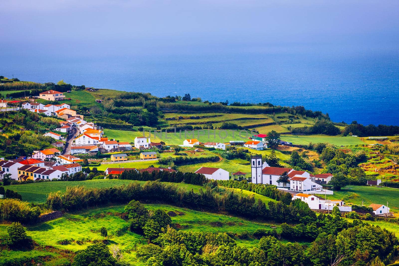 Beautiful nature view on Azores with small villages, tows, green nature fields. Amazing Azores. View of typical Azores village in Sao Miguel island, Azores, Portugal.